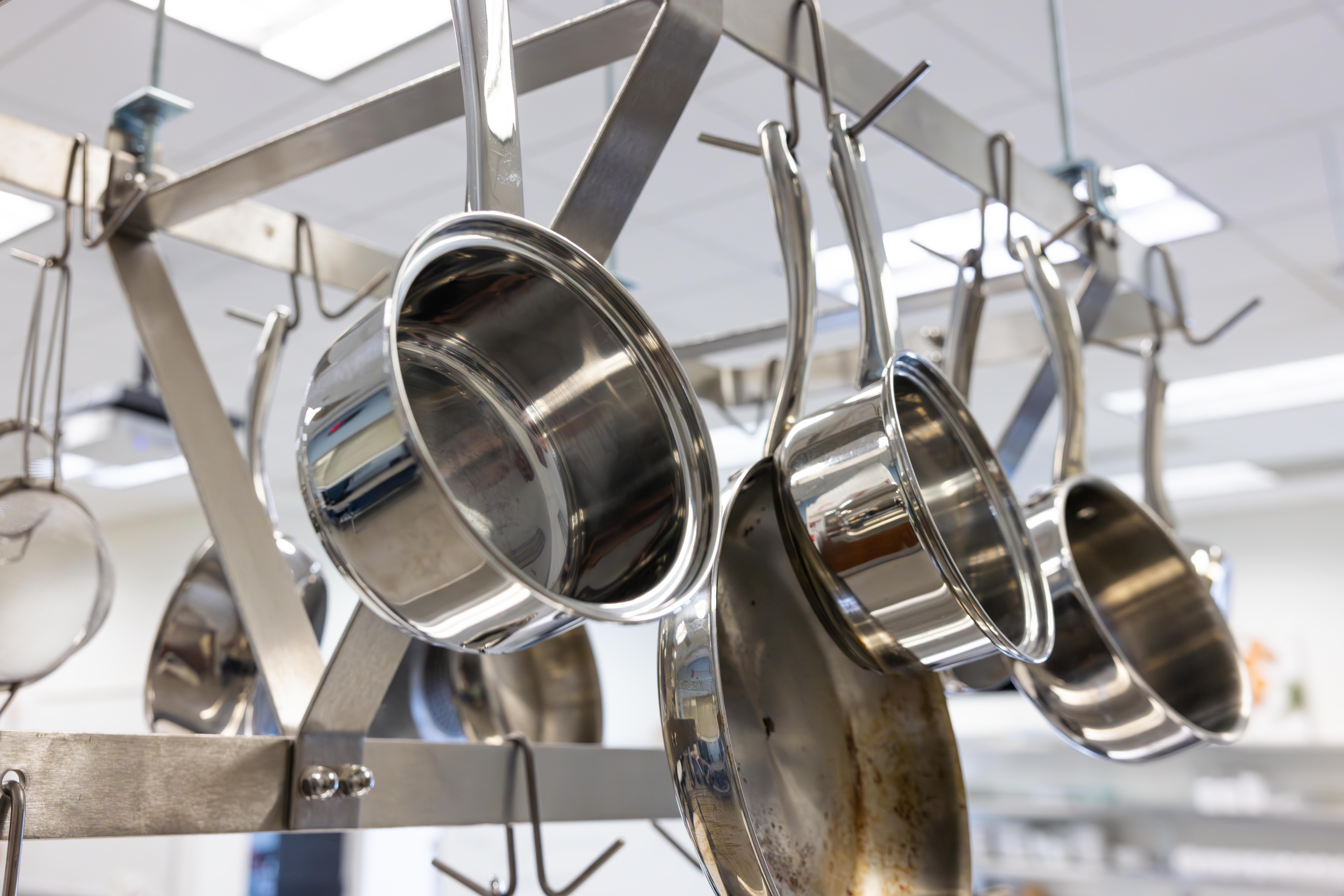 Close up of pans hanging from a rack in the Harper Nutrition lab