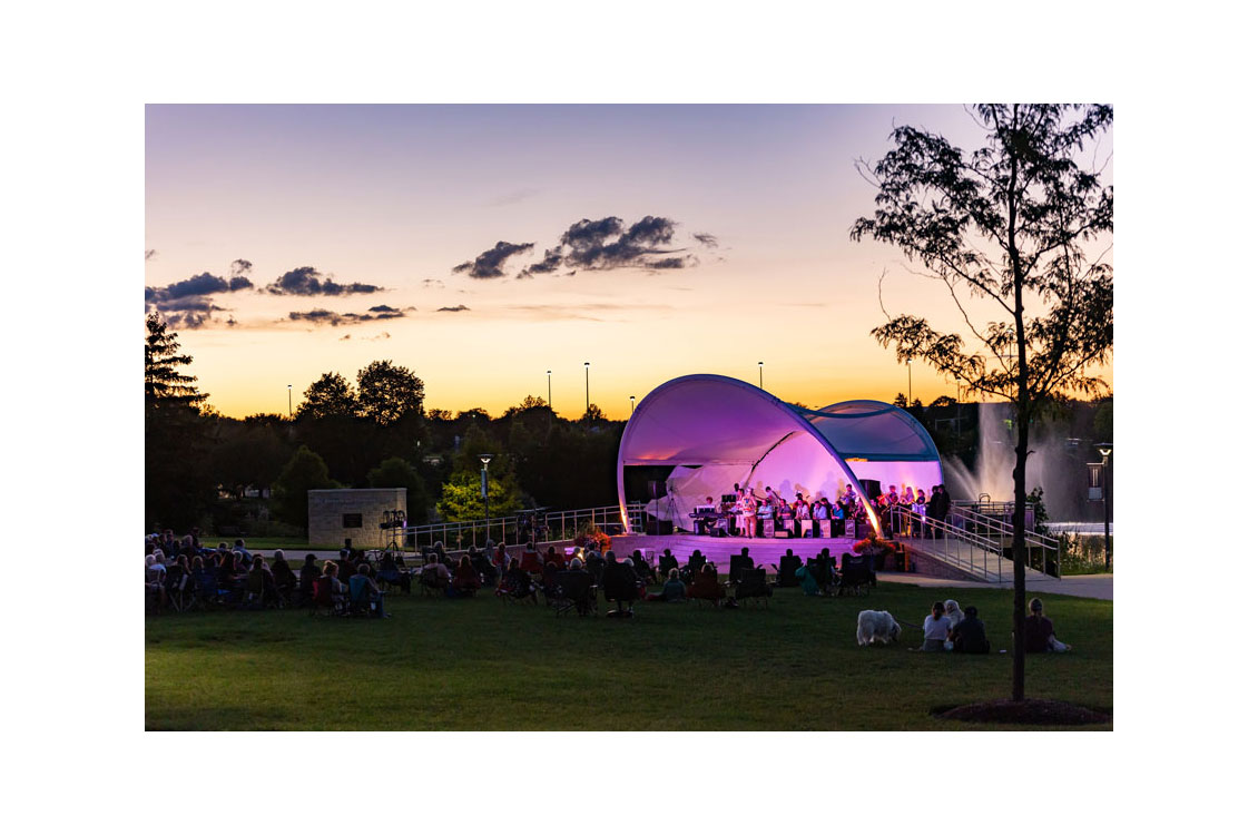 wide shot of an outdoor concert at Harper at dusk