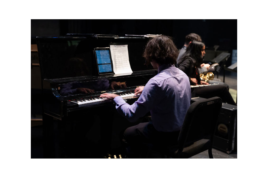 a student plays the piano